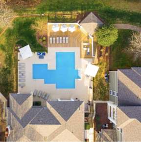 A bird's eye view of a house with a swimming pool.