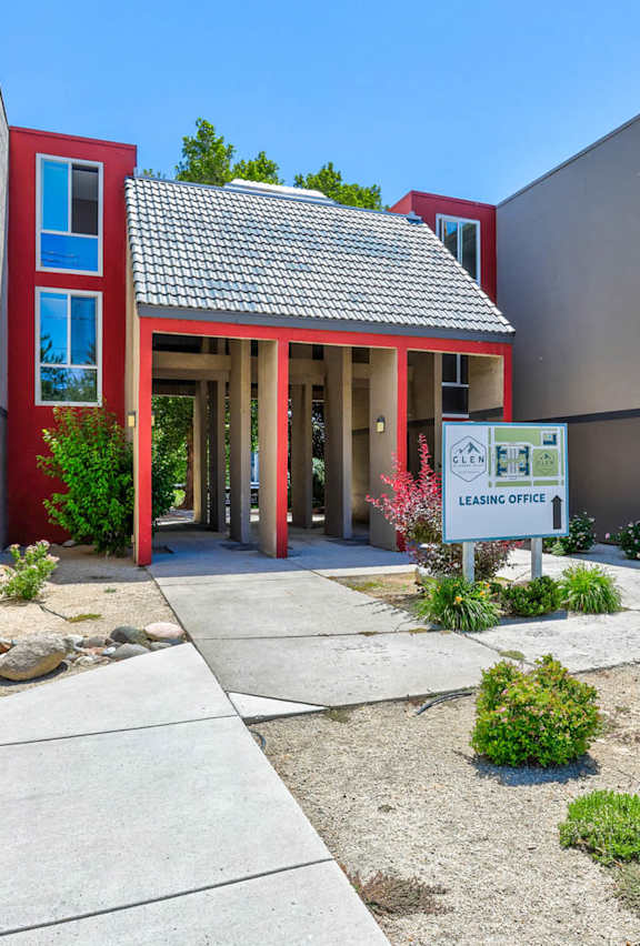 A reception area with a blue wall and a sign that says Glen at Hidden Valley, Reno, Nevada