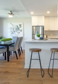 a kitchen and dining area in a 555 waverly unit
