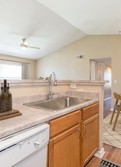 a kitchen with a sink and a dining table