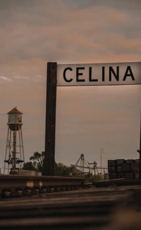 a sign that reads cielina with a water tower in the background