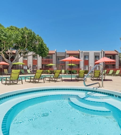 Soothing spa with view of the pool at Spring Meadow Apartments in Arizona 85302