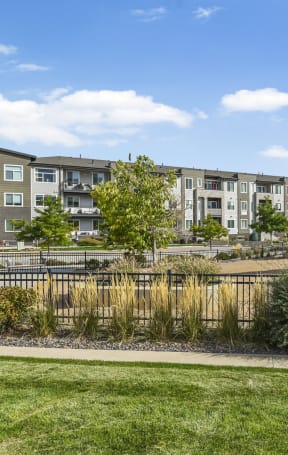 a dining room with a wooden table and chairs at Parkside at Littleton Village, Littleton, 80122