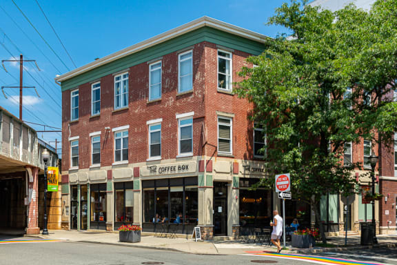 the front of a building with a sign for a wine tasting and a beer store