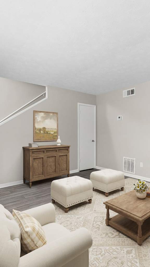 A white dresser with a mirror and a lamp on top of it.