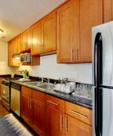 The Post Apartments  kitchen area with stainless steel appliances