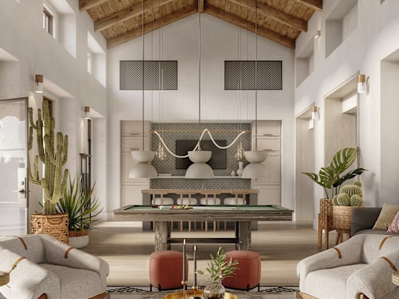 A modern living room with a large sofa set, a coffee table, and a fireplace.
