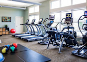 Thumbnail 19 of 28 - fitness room at The Commons Weymouth during a sunny day