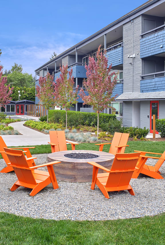 outdoor fire pit with orange chairs at 3030 Lake City, Washington