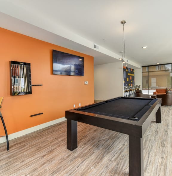 a billiards table in a hotel room with a blue pool table