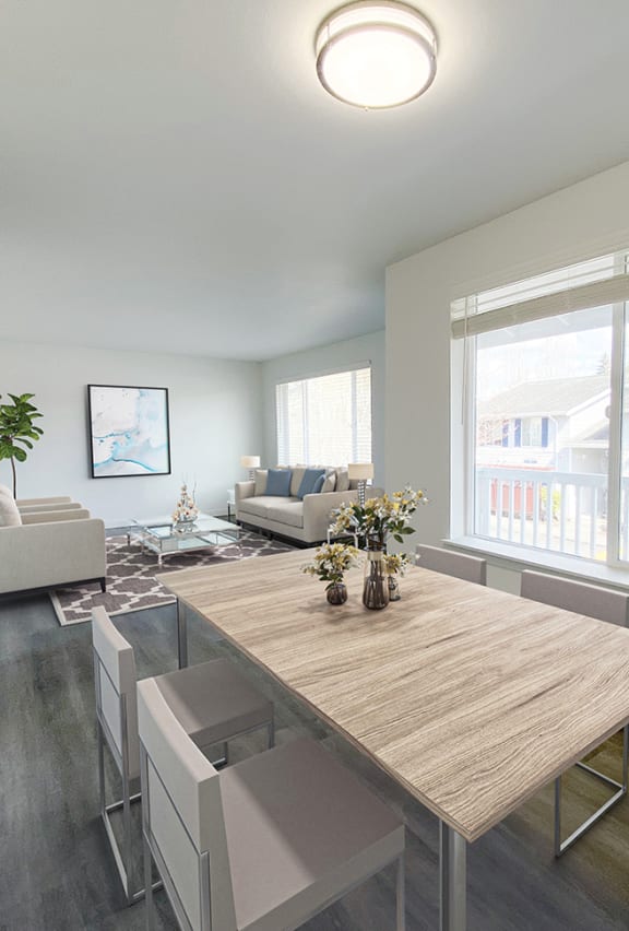 Dining area with wood-style flooring to the right, and the kitchen with a pass through window to the left.at The Trail, Washington
