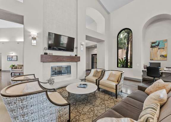 A living room with a grey sofa and a coffee table.