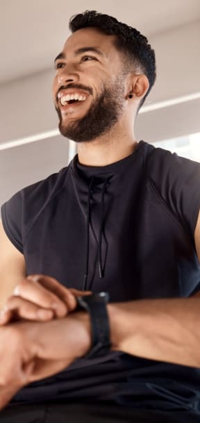 Man Smiling while Working Out