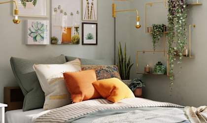 a bedroom with a bed and plants and a window
