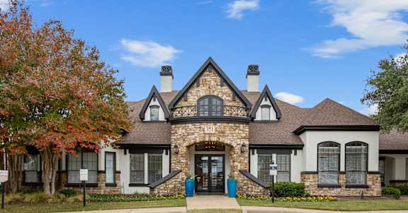 Villas of Vista Ridge Leasing Center, surrounded by trees