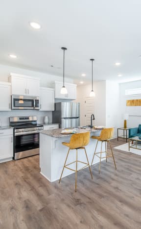 a living room with a kitchen and a dining room