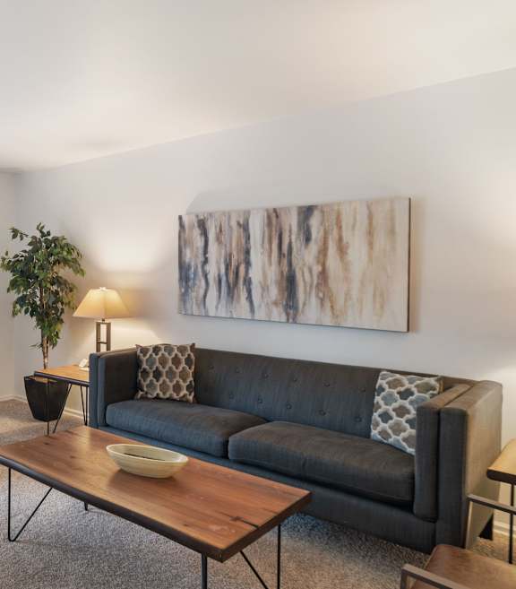 a living room with a couch and a coffee table