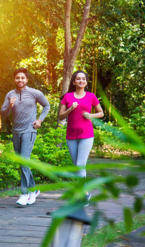 a couple jogging in a park