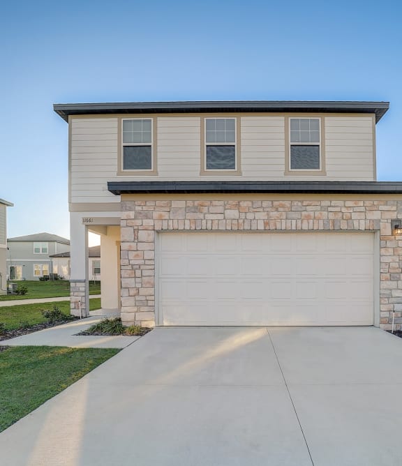 House Exteriors with Beautifully Kept front yards at Beacon at Clinton Corners