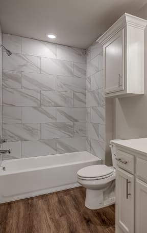 a bathroom with a bathtub and a sink