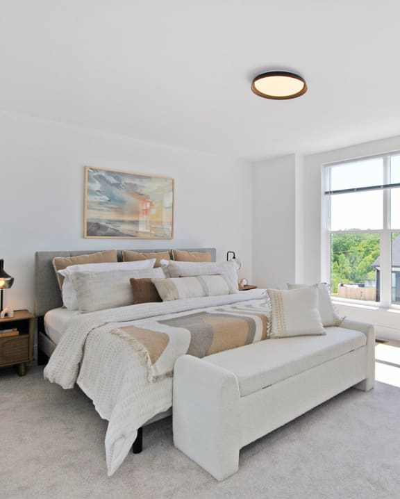 a bedroom with a couch and a bed