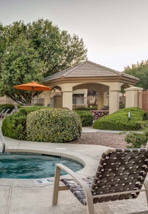 a pool and hot tub with chairs and umbrellas at Links at High Resort, Rio Rancho, NM, 87124