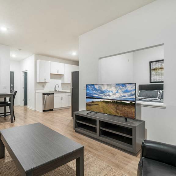 Living room of studio apartment for rent at The Conrad near UNMC in Omaha NE