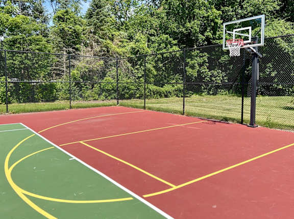 A basketball court with a hoop and a net.