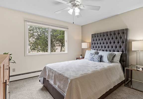 bedroom with window and ceiling fan
