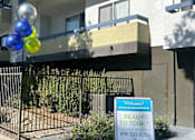 Thumbnail 44 of 45 - a view from above of a building with balloons on the ground