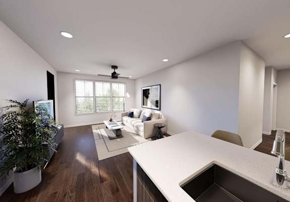 A modern kitchen with a large island and a dining area with a potted plant. at Stack at Wheat Ridge Apartments, Apartments, Wheat Ridge, CO