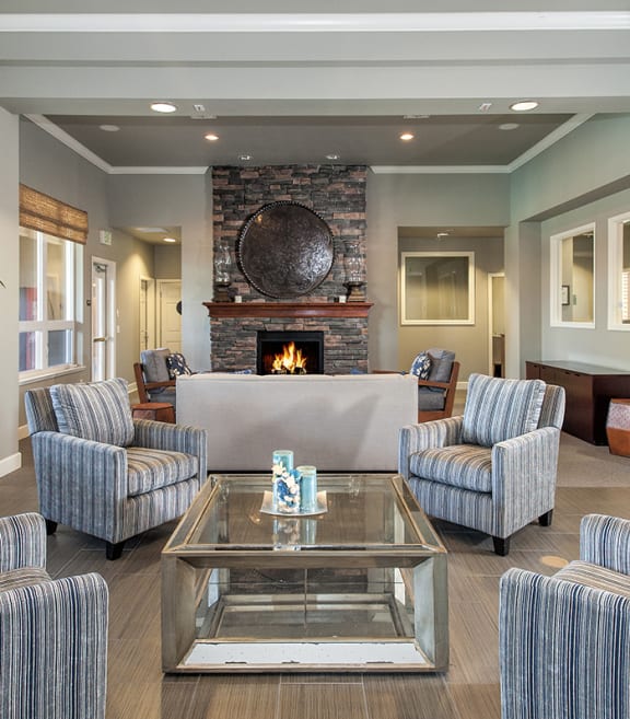 Stoneridge apartments clubhouse seating area and fire place 