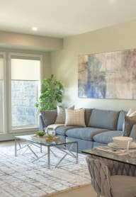 a living room with a couch and a chair