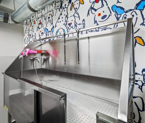 a kitchen with a stainless steel counter top and a sink