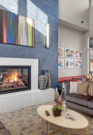 A living room with a fireplace and a couch.