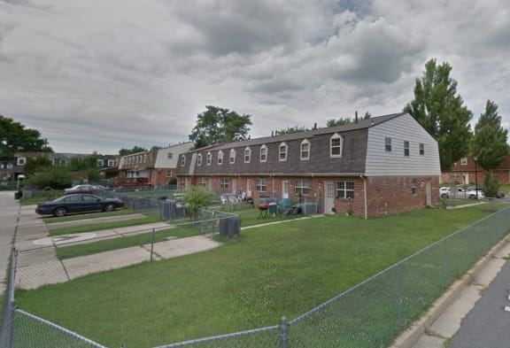 a screenshot of google street view at Kingston Townhomes, Baltimore, Maryland