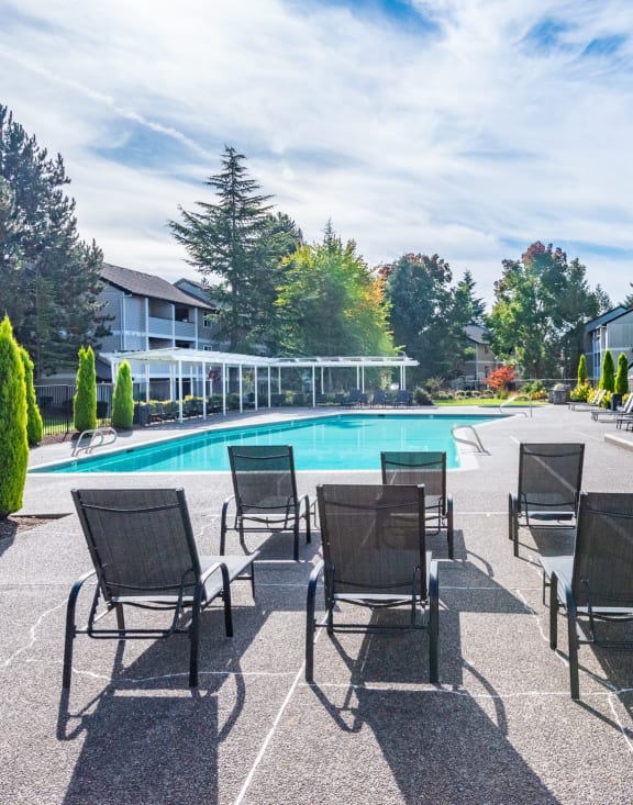 Lounge chairs at the Sir Charles Court apartments pool 
