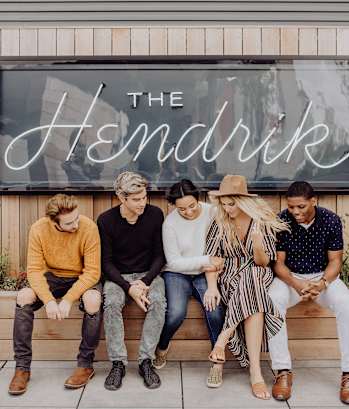 People in front of sign