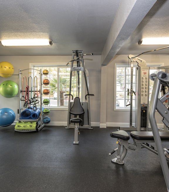 apartments fitness center training equipment at Woodbridge Apartments, California