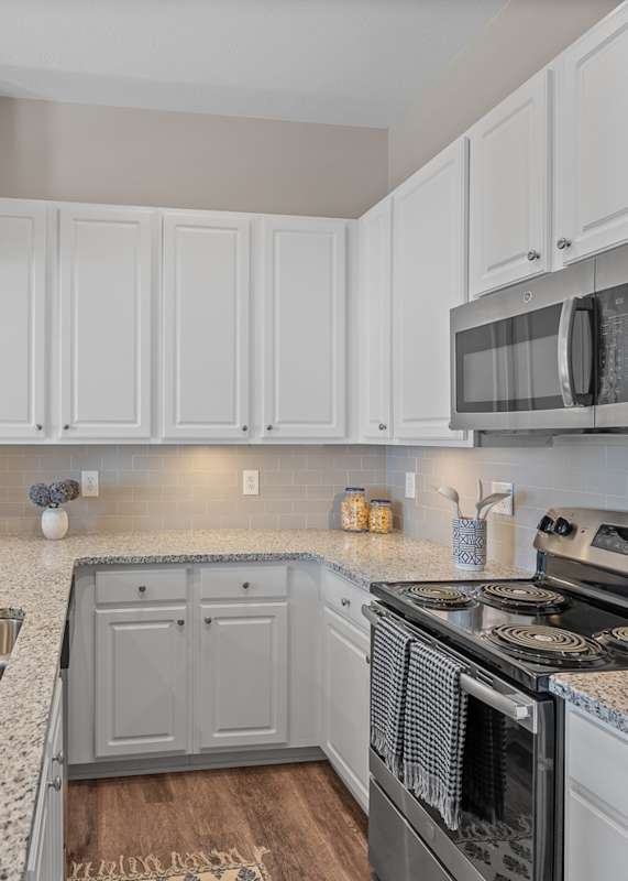 Kitchen with cabinets at The Falls at Landen Apartments, Maineville, OH