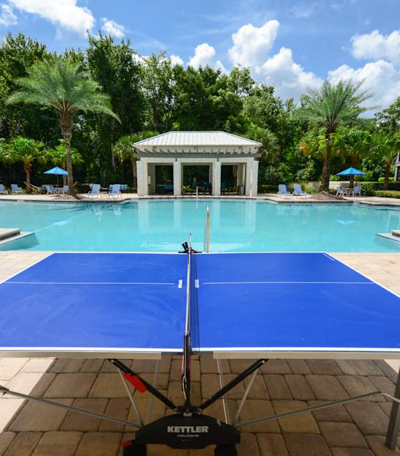 A pool with a table in the middle of it.