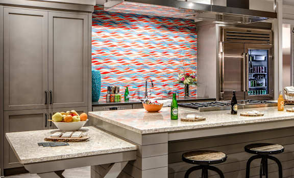 a large kitchen with a large center island with a marble countertop at The Standard, Charleston, SC, 29412
