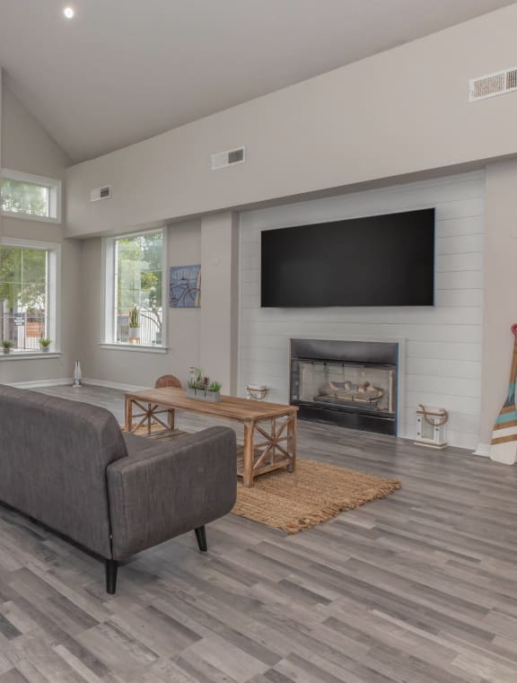 a large living room with a kitchen and a dining room