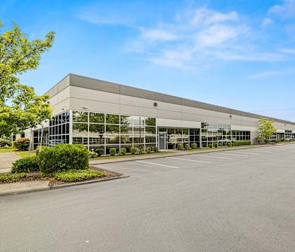Sunset West Business Park in Hillsboro, Oregon, exterior building and parking lot.