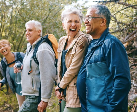 Friends Smiling while Hiking Together