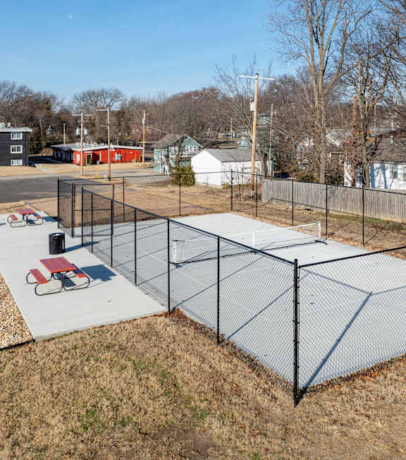Tennis Court Enclosed by Fence at University Digs Apartments, Pittsburg, KS