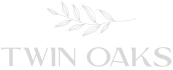 a logo for twin oaks townhomes
