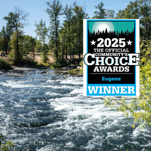 A river flows through a wooded area with a sign overlay stating "2025 Official Choice Awards Winner".