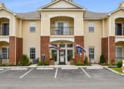 Thumbnail 33 of 34 - Exterior View Of Austin Place Apartments' Clubhouse Entrance
