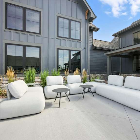 A patio with a table and chairs at The Garrison Luxury Apartment Homes, Fountain, CO
